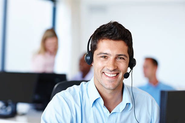 Portrait of a smiling young businessman wearing a headset